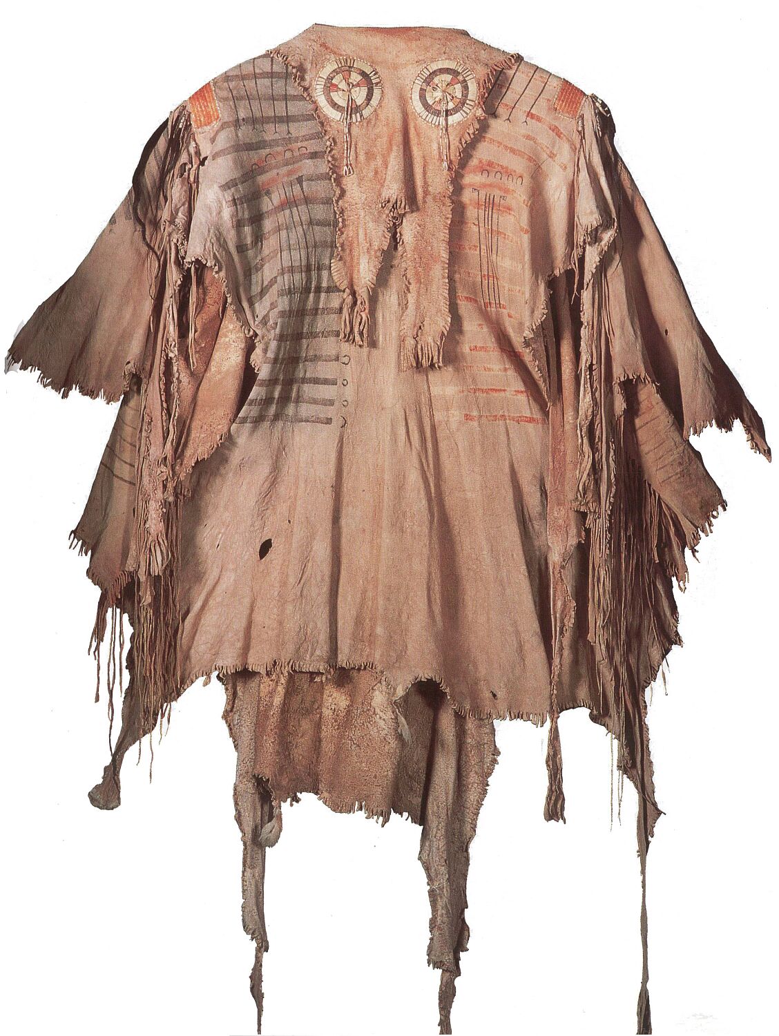 A Blackfoot war shirt from before 1820. The bib has a natural neck shape and is decorated with quilled rosettes.