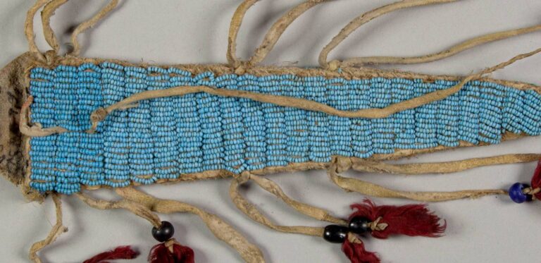 A bag embroidered with the light blue beads.