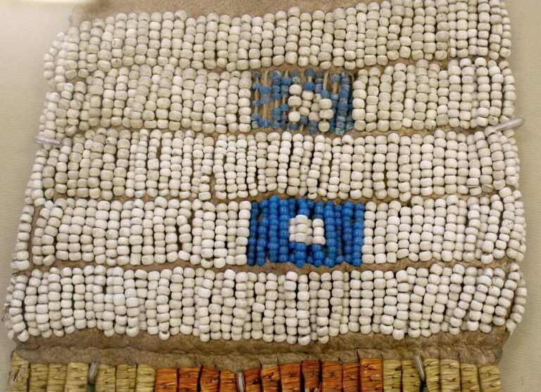 A detail of a Cheyenne pipe bag (probably). It is embroidered with pony beads, white and powder blue. It certainly dates from before 1840. British Museum, London.