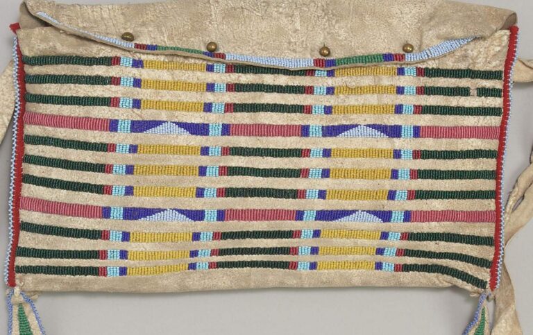 A Crow tipi bag. Some part of its lanes are beaded with transparent pink beads.