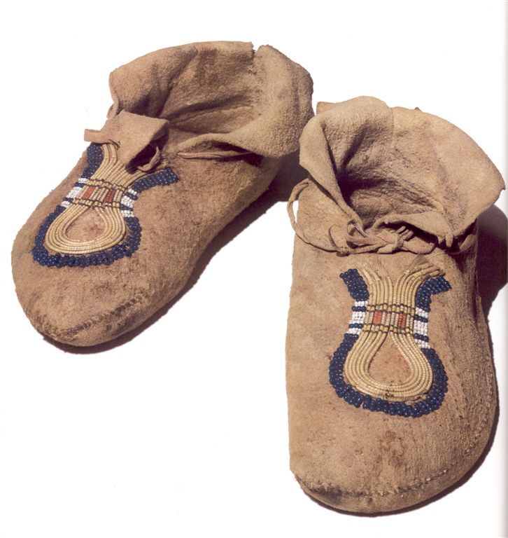 Crow indians side seam moccasins. They are decorated with pony beads and quill wrapped horse hair technique.